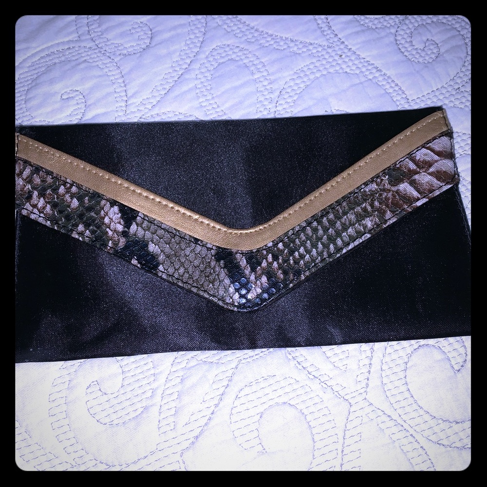 Black with snake skin detail flat clutch. **BOGO same or less$